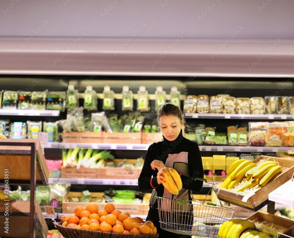 Woman buying fruits at the market