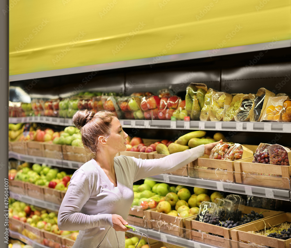 Woman buying fruits at the market