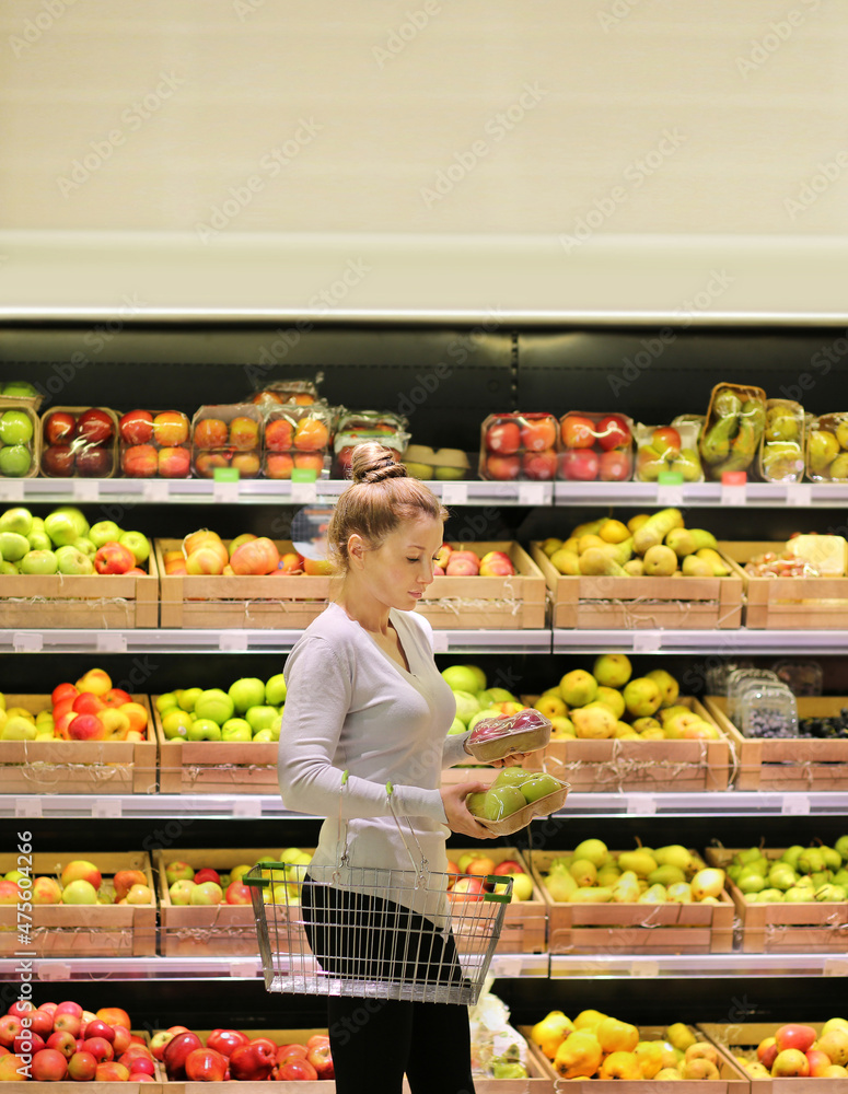 Woman buying fruits at the market