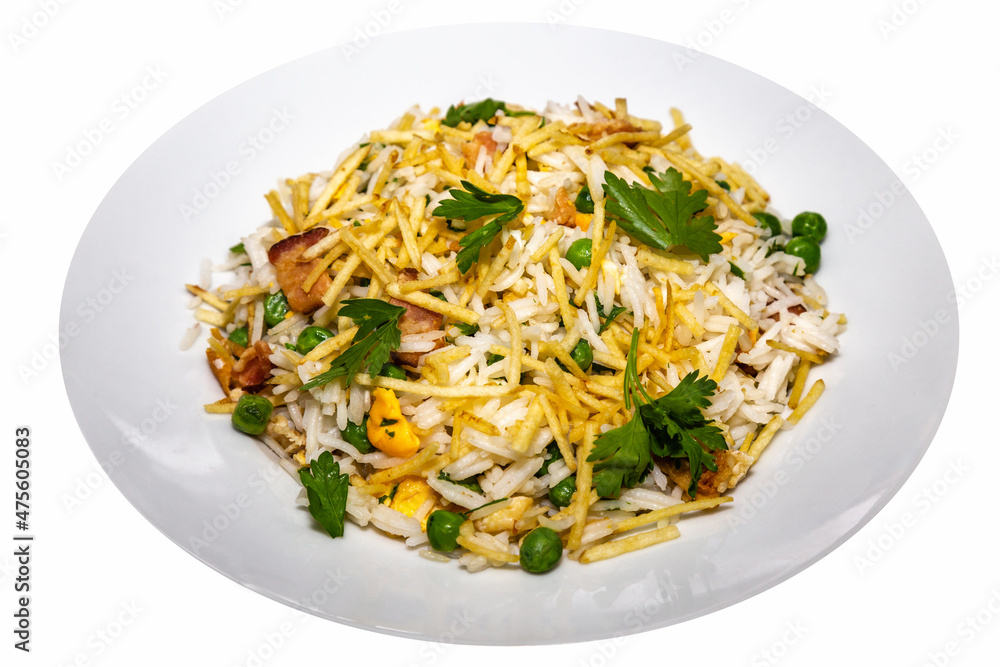 Biro-biro rice is a typical Brazilian dish to accompany or as a main course. Parsley, potato sticks, peas, egg, and bacon. Isolated on round plate Biro-biro rice is a typical Brazilian dish to accompany or as a main course. Parsley, potato sticks, peas, egg, and bacon. Isolated on round plate
