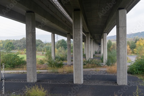 Underneath highway bridge pillars view