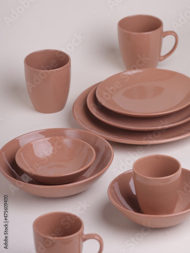 set of brown ceramic dishes on a light background
