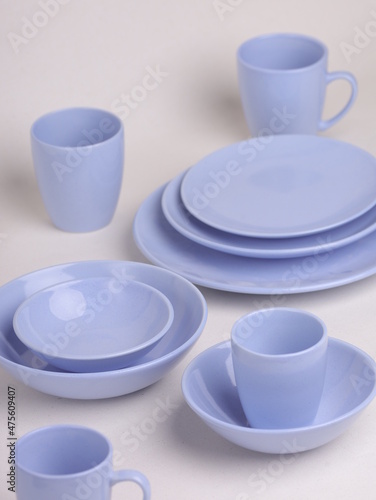 set of pyrple ceramic dishes on a light background