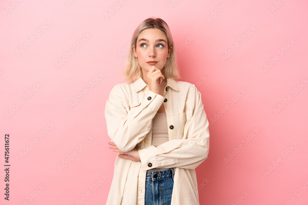 Young caucasian woman isolated on pink background thinking an idea while looking up Young caucasian woman isolated on pink background thinking an idea while looking up