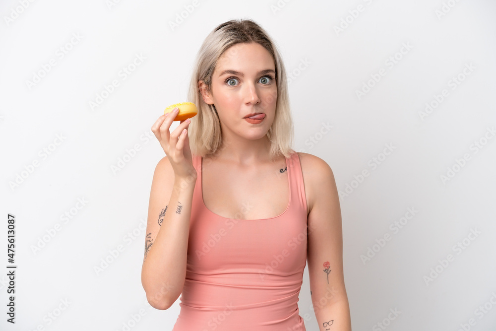 Young caucasian woman isolated on white background holding a donut Young caucasian woman isolated on white background holding a donut