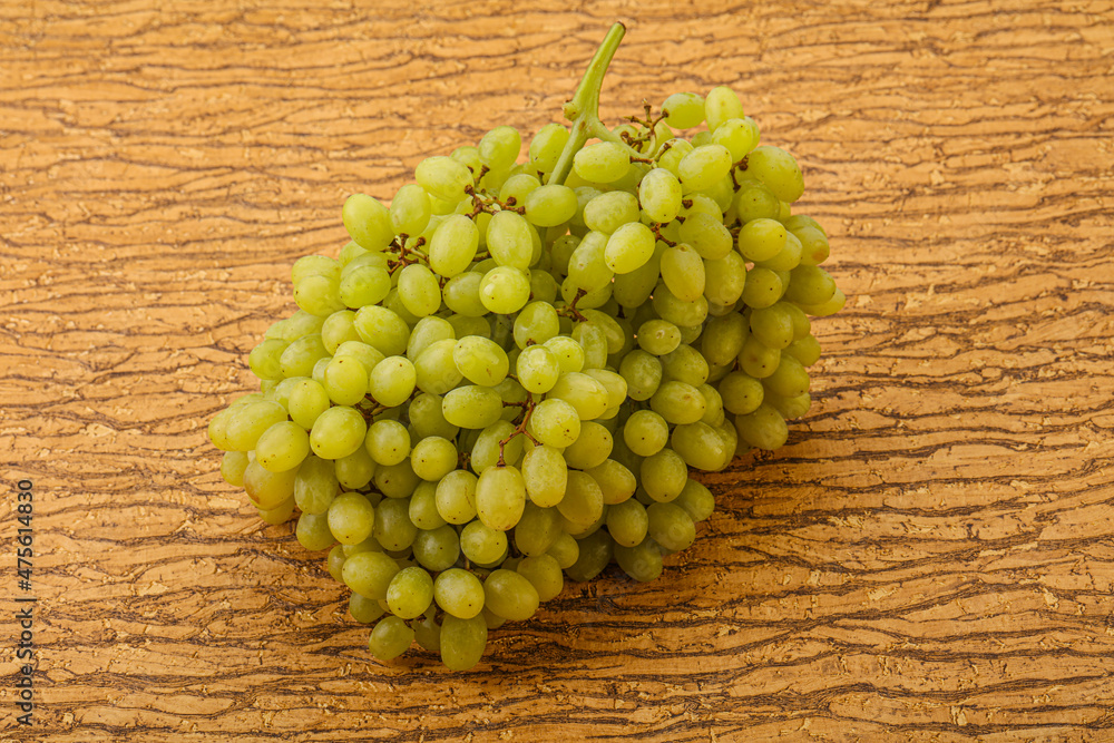 Green grape branch over background Green grape branch over background
