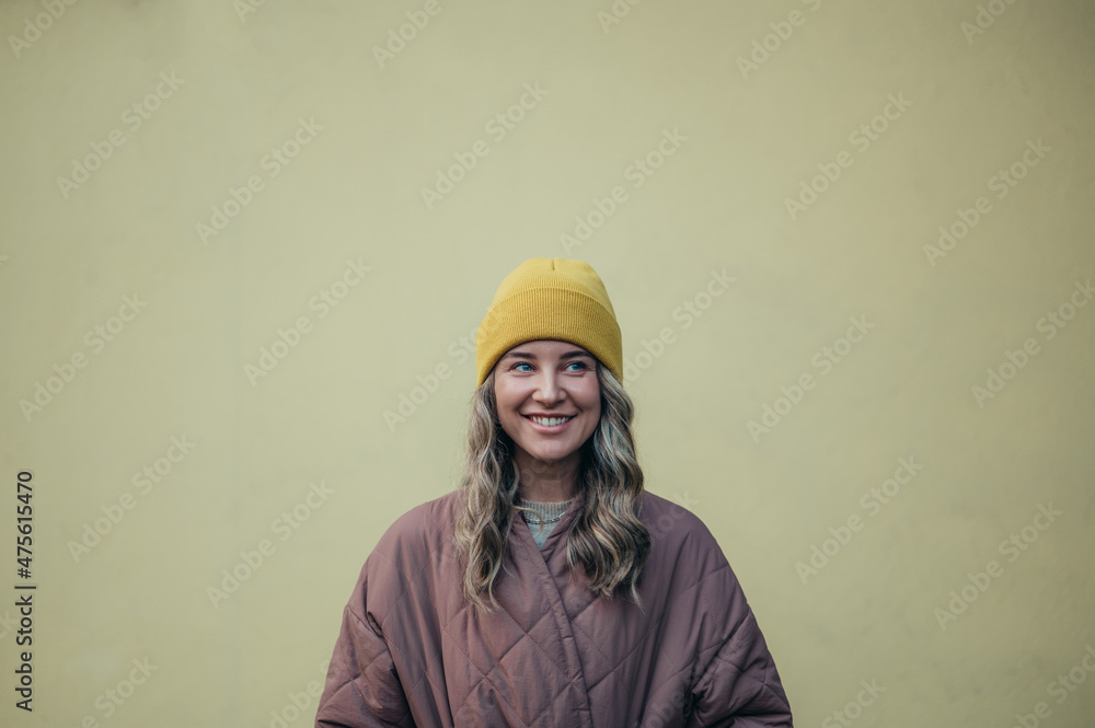 Beautiful young stylish woman wearing coat and a cap Beautiful young stylish woman wearing coat and a cap