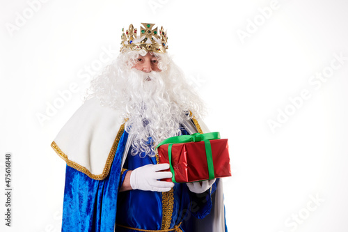 A magician with a present on a white background