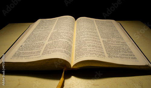 open bible reflected with warm light