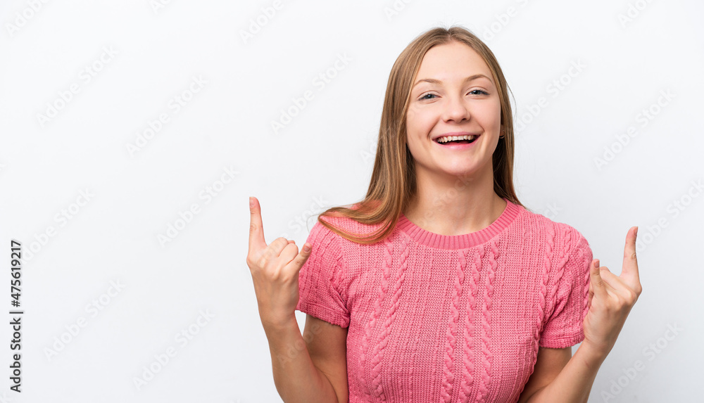 Young Russian woman isolated on white background making horn gesture Young Russian woman isolated on white background making horn gesture