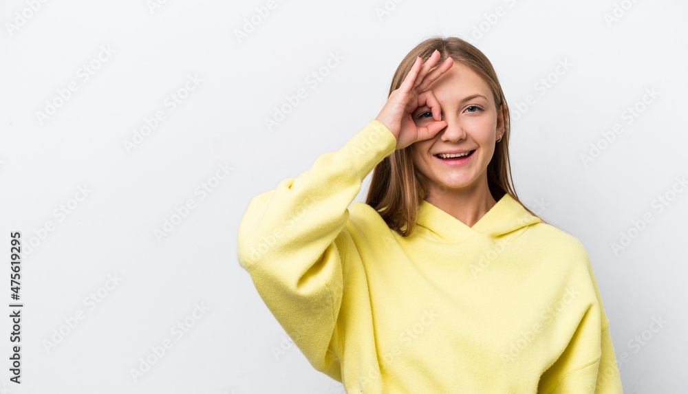 Young Russian woman isolated on white background showing ok sign with fingers Young Russian woman isolated on white background showing ok sign with fingers