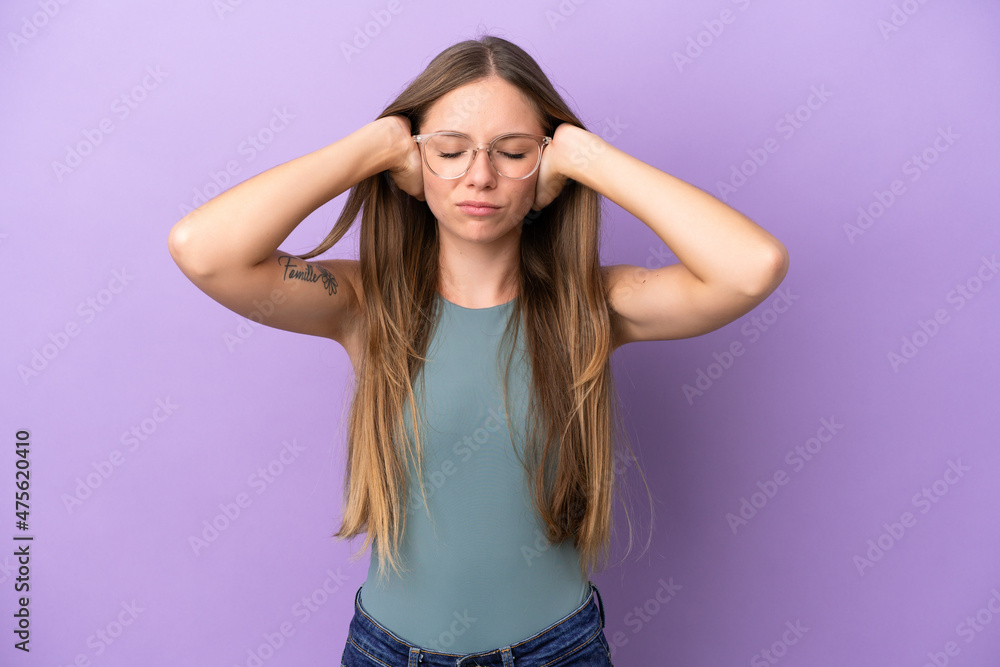 Young Lithuanian woman isolated on purple background frustrated and covering ears Young Lithuanian woman isolated on purple background frustrated and covering ears