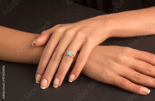 Diamond colors ring on woman hand