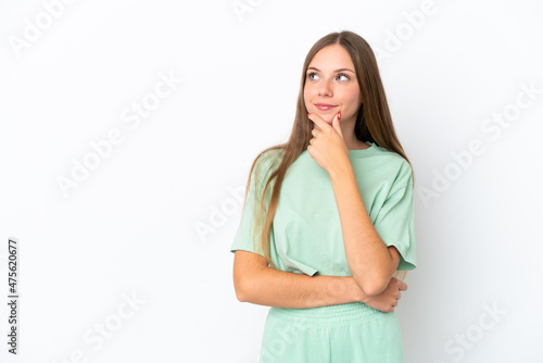 Young Lithuanian woman isolated on white background thinking an idea while looking up