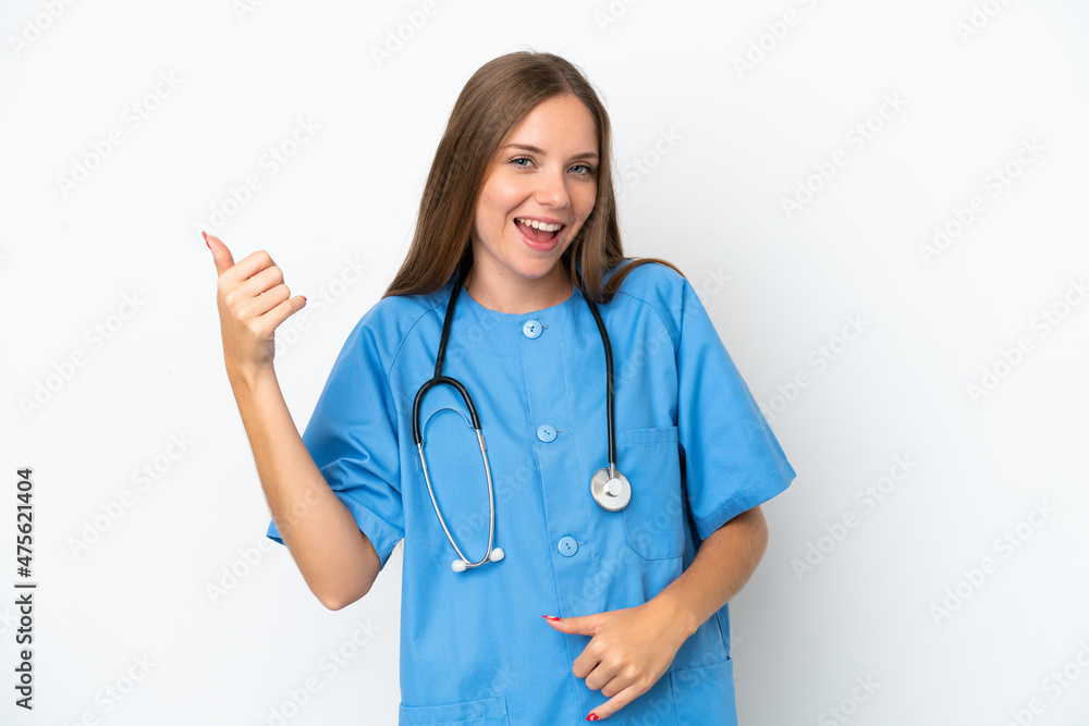 Young surgeon doctor Lithuanian woman isolated on white background making guitar gesture Young surgeon doctor Lithuanian woman isolated on white background making guitar gesture