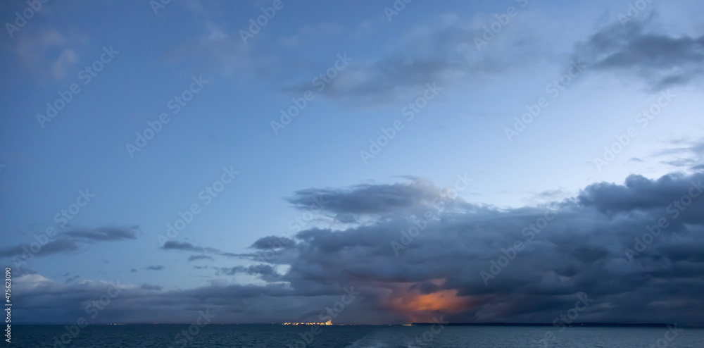 Dark Cloudscape over the West Coast of Pacific Ocean. Taken in British Columbia, Canada. Morning winter sunrise. Sky Nature Background