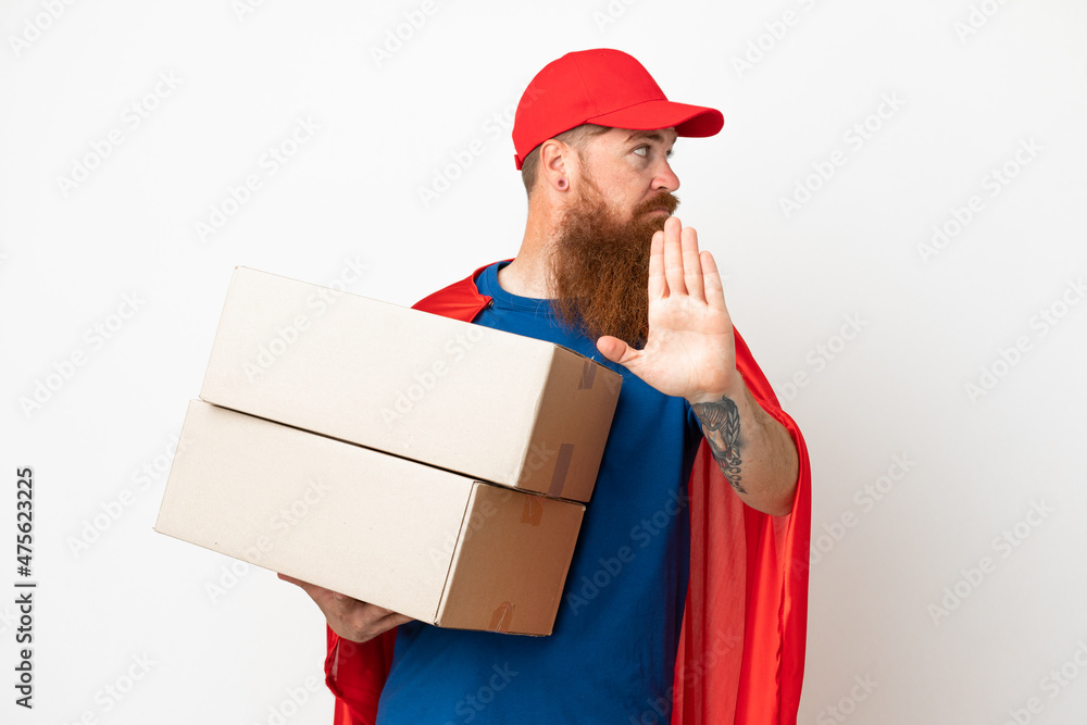 Super Hero delivery reddish man isolated on white background making stop gesture and disappointed Super Hero delivery reddish man isolated on white background making stop gesture and disappointed