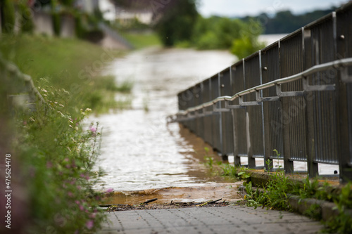 Принти на полотні flood at sidewalk shows high water raising by heavy rainfalls making huge damage