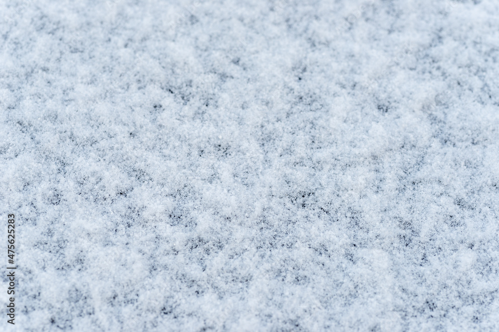 Lightly piled snow on black table in Japan