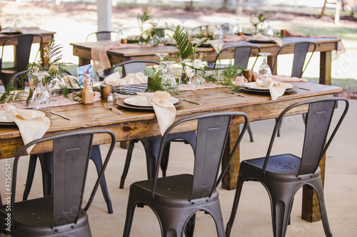 Fotografija Simple Rustic Wooden Farm Tables Decorated for Wedding Reception with Grey Cafe