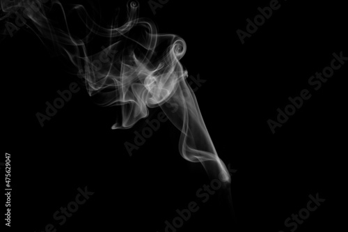 Close up of incense smoke on black background