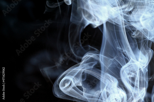 Close up of incense smoke on black background