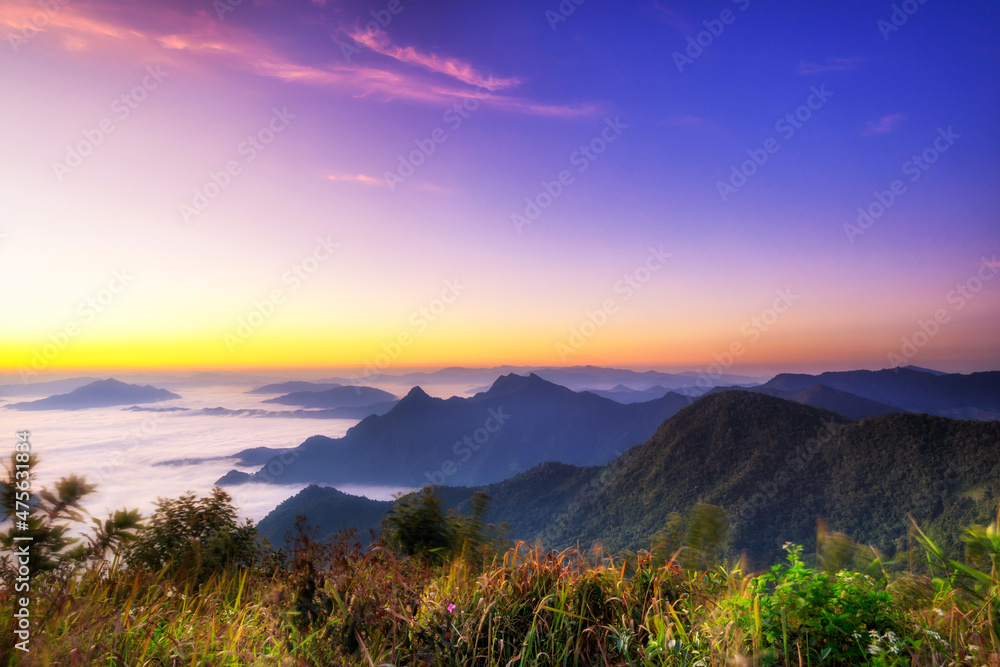 Starlight Sunrise scene with the peak of mountain called Phu Chifa at Chiangrai Thailand with Fog over the city below