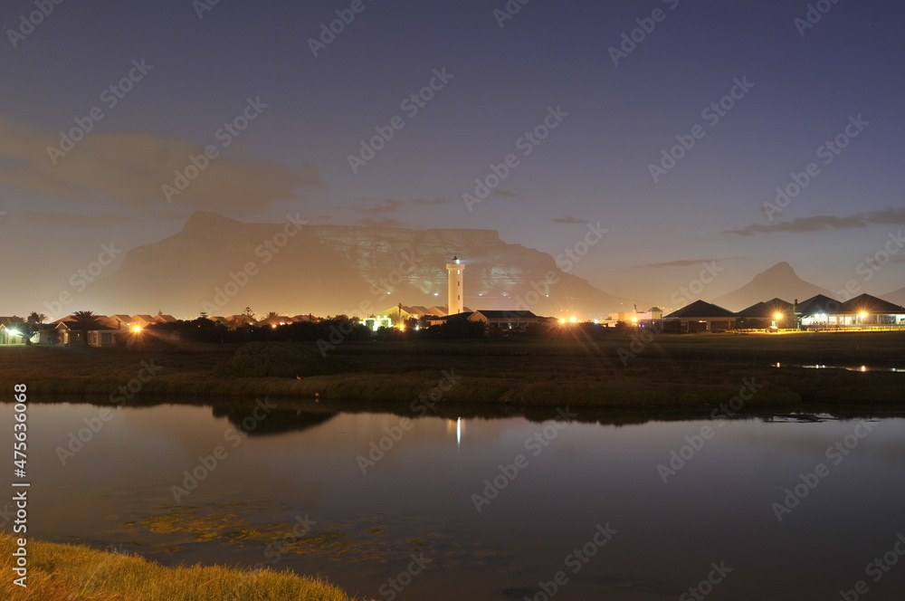 Table Mountain Panoramic Landscape with Beautiful Colorful Sunset and Streaking Clouds Landscape, Cape Town, South Africa. Sunset over the river. 