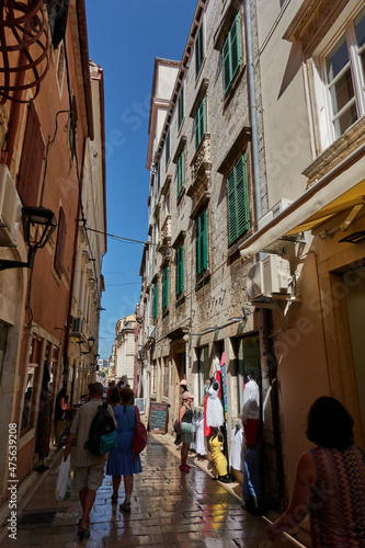 Zadar, Croatia - August 7, 2021 - narrow streets of the ancient fishing town in the summer sunny afternoon