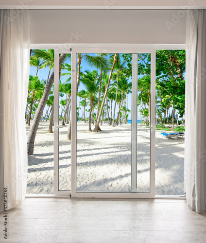 large glass door overlooking the beach
