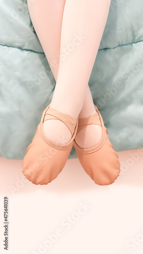 Baby ballet: little ballerina with her feet crossed