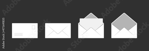 Set of white envelopes on a dark background. 