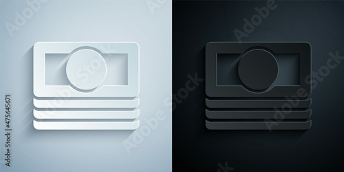 Paper cut Stacks paper money cash icon isolated on grey and black background. Money banknotes stacks. Bill currency. Paper art style. Vector