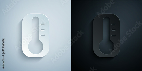Paper cut Meteorology thermometer measuring heat and cold icon isolated on grey and black background. Thermometer equipment showing hot or cold weather. Paper art style. Vector