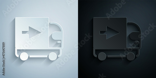 Paper cut Delivery cargo truck vehicle icon isolated on grey and black background. Paper art style. Vector