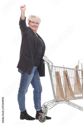 full-length. casual mature woman with shopping cart .
