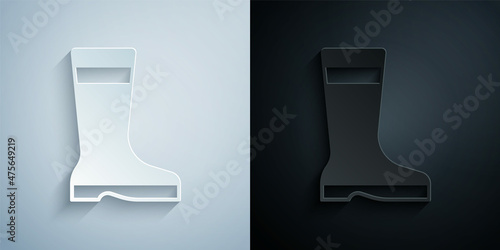 Paper cut Fishing boots icon isolated on grey and black background. Waterproof rubber boot. Gumboots for rainy weather, fishing, hunter, gardening. Paper art style. Vector