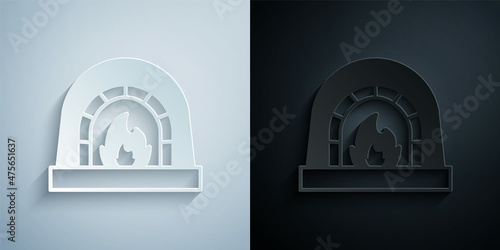 Paper cut Blacksmith oven icon isolated on grey and black background. Paper art style. Vector