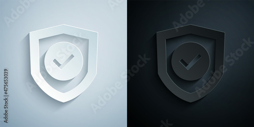 Paper cut Shield with check mark icon isolated on grey and black background. Protection symbol. Security check Icon. Tick mark approved icon. Paper art style. Vector
