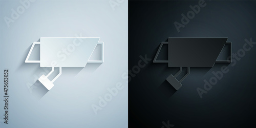 Paper cut Security camera icon isolated on grey and black background. Paper art style. Vector