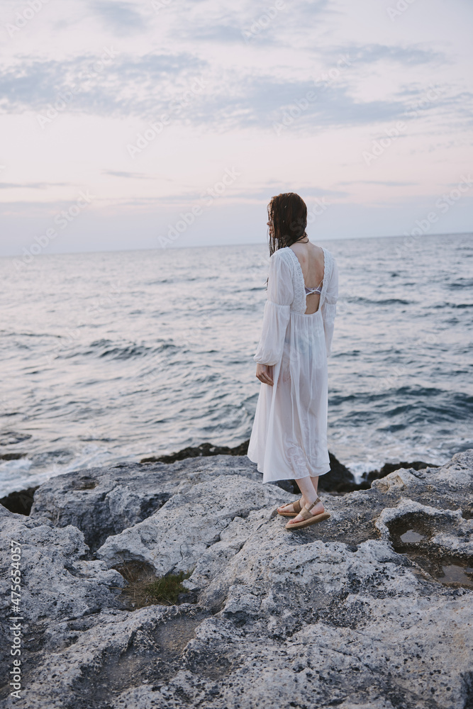 Woman in white dress ocean nature travel freedom Woman in white dress ocean nature travel freedom