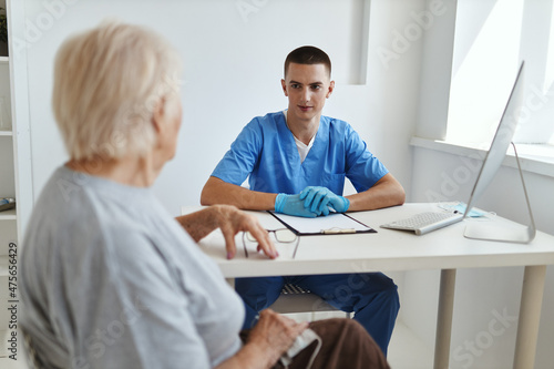 elderly woman patient talking to doctor health care