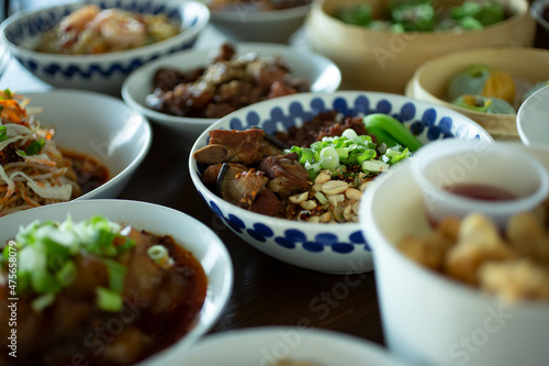 A view of several modern Chinese entrees, featuring a dish of marinated pork spare ribs.