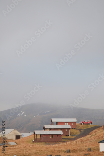 Beautiful shot of three houses on a hil photo