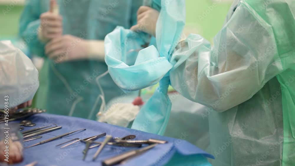 inside modern surgery, table with tools of surgeon, health professionals is working inside modern surgery, table with tools of surgeon, health professionals is working