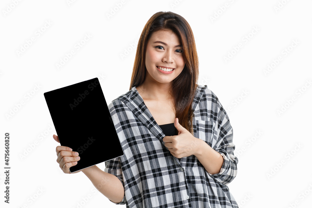 Portrait studio shot of Asian happy pretty long hair female model in plaid shirt standing smiling look at camera showing presenting blank screen tablet for ads and hold thumb up on white background Portrait studio shot of Asian happy pretty long hair female model in plaid shirt standing smiling look at camera showing presenting blank screen tablet for ads and hold thumb up on white background