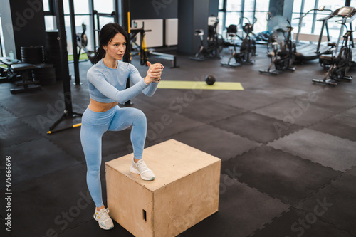 Athletic woman warming up on crossfit box
