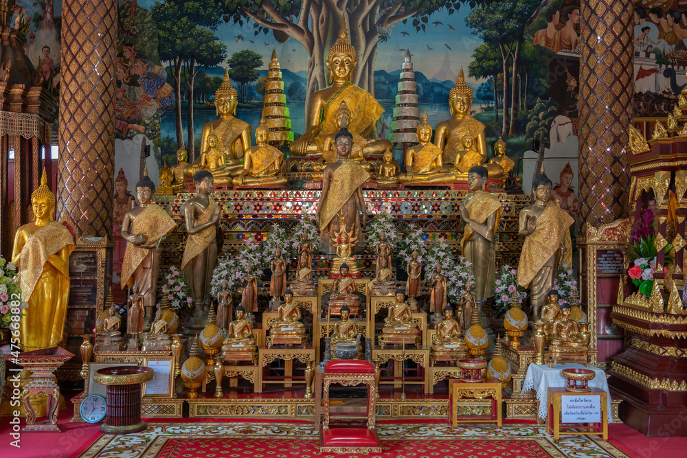Sacred golden Buddha statues inside main vihara at ancient Wat Chai Sri Phum buddhist temple, Chiang Mai, Thailand