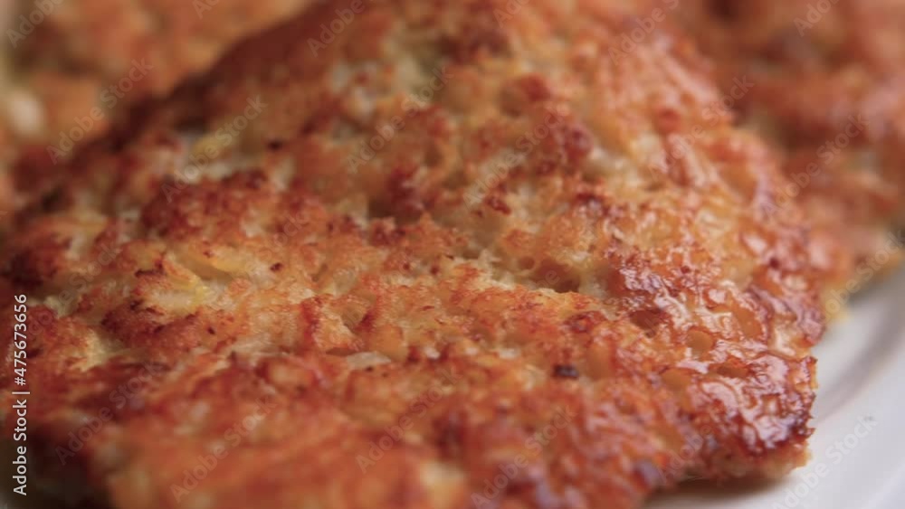 CLOSE-UP: Three delicious meat patties rotating with a plate. Dining room showcase. CLOSE-UP: Three delicious meat patties rotating with a plate. Dining room showcase.