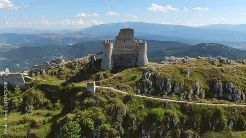 rocca calascio fortress aerial view drone flying up over abruzzi mountains landscape photo